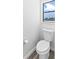 Simple and updated half bathroom with a window at 2955 N Beach Rd # A531, Englewood, FL 34223