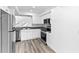 Updated kitchen featuring white cabinets and stainless steel appliances at 2955 N Beach Rd # A531, Englewood, FL 34223