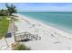 Steps lead to a pristine beach; tranquil waters and blue skies at 2955 N Beach Rd # A531, Englewood, FL 34223
