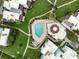 Community pool with surrounding landscaping at 2955 N Beach Rd # A531, Englewood, FL 34223