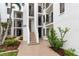 Condo building exterior with landscaping at 2955 N Beach Rd # A531, Englewood, FL 34223