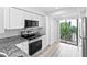 Modern kitchen with stainless steel appliances and granite countertops at 2955 N Beach Rd # A531, Englewood, FL 34223