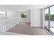 Open loft space featuring multiple windows and balcony access at 2955 N Beach Rd # A531, Englewood, FL 34223