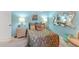 Serene bedroom with a comfortable bed, stylish decor, and a large mirror at 3502 Bahia Vista St, Sarasota, FL 34239