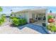 Charming house with a covered patio and landscaped yard at 3502 Bahia Vista St, Sarasota, FL 34239