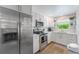 Modern kitchen featuring stainless steel appliances and white cabinets at 3502 Bahia Vista St, Sarasota, FL 34239