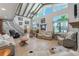 Open concept living room with hardwood floors, fireplace, and loft at 3502 Bahia Vista St, Sarasota, FL 34239