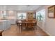 Dining area with wood table and access to kitchen at 3502 Bahia Vista St, Sarasota, FL 34239
