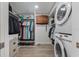 Laundry room with washer, dryer, and shelving at 3502 Bahia Vista St, Sarasota, FL 34239