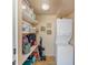 Convenient laundry room with stackable washer and dryer, and storage shelves at 3502 Bahia Vista St, Sarasota, FL 34239