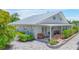 Home features a metal roof and a spacious covered patio at 3502 Bahia Vista St, Sarasota, FL 34239