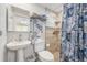 Clean bathroom with shower/tub combo and pedestal sink at 3502 Bahia Vista St, Sarasota, FL 34239
