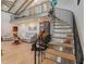 Elegant spiral staircase with metal railing in living room at 3502 Bahia Vista St, Sarasota, FL 34239