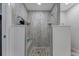 Spa-like shower with pebble floor and modern tile work at 3502 Bahia Vista St, Sarasota, FL 34239