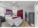 Primary bedroom with a king-size bed and burgundy accents at 3502 Bahia Vista St, Sarasota, FL 34239
