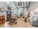 High-ceiling living room with hardwood floors, fireplace, and loft area at 3502 Bahia Vista St, Sarasota, FL 34239