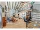 Open living area with vaulted ceiling, fireplace, and spiral staircase at 3502 Bahia Vista St, Sarasota, FL 34239