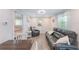 Relaxing living room with leather sofas, recliner, and dining area at 3502 Bahia Vista St, Sarasota, FL 34239