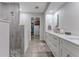 Double vanity bathroom with a large walk-in shower and walk-in closet at 3502 Bahia Vista St, Sarasota, FL 34239