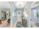 Bright entryway with tile flooring, decorative console table, and access to other rooms at 3502 Bahia Vista St, Sarasota, FL 34239