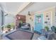 Relaxing screened porch with fireplace and seating at 3502 Bahia Vista St, Sarasota, FL 34239