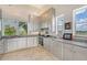 Modern kitchen with granite counters and stainless steel appliances at 5444 Gulf Of Mexico Dr, Longboat Key, FL 34228
