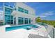Luxury pool area with a spa and water views at 5444 Gulf Of Mexico Dr, Longboat Key, FL 34228