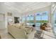 Living area featuring ample seating and pool views at 5444 Gulf Of Mexico Dr, Longboat Key, FL 34228