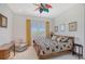 Bedroom with floral bedding and wooden furniture at 5444 Gulf Of Mexico Dr, Longboat Key, FL 34228