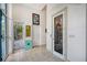 Bright entryway with elevator access, tile floors, and access to a private patio at 5444 Gulf Of Mexico Dr, Longboat Key, FL 34228