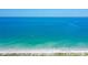 Expansive beach view with clear water and blue sky at 5444 Gulf Of Mexico Dr, Longboat Key, FL 34228