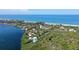 Aerial view of a waterfront property with beach access at 5444 Gulf Of Mexico Dr, Longboat Key, FL 34228