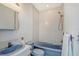 Clean bathroom with a blue bathtub, sink, and shower at 5444 Gulf Of Mexico Dr, Longboat Key, FL 34228