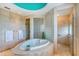 Spacious bathroom with heart-shaped tub and separate shower at 5444 Gulf Of Mexico Dr, Longboat Key, FL 34228