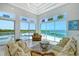 Living room with water views,sliding doors, and comfortable seating at 5444 Gulf Of Mexico Dr, Longboat Key, FL 34228
