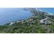 Aerial view of a large waterfront lot with surrounding homes at 5444 Gulf Of Mexico Dr, Longboat Key, FL 34228