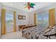 Bedroom with floral bedding and wooden furniture at 5444 Gulf Of Mexico Dr, Longboat Key, FL 34228
