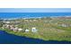 Aerial showing home site on a wooded lot near the ocean at 5444 Gulf Of Mexico Dr, Longboat Key, FL 34228