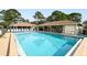 Inviting community pool with ample lounge chairs and covered seating area at 773 N Jefferson Ave # 773, Sarasota, FL 34237