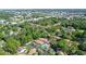 Aerial view showcasing a residential community, featuring a pool and surrounded by green space at 773 N Jefferson Ave # 773, Sarasota, FL 34237