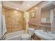 Clean bathroom with shower/tub combo, glass shelf and vanity at 773 N Jefferson Ave # 773, Sarasota, FL 34237