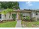 Ranch home with a walkway and lush landscaping at 773 N Jefferson Ave # 773, Sarasota, FL 34237
