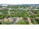 Aerial perspective of a tranquil community nestled amidst greenery, complete with a pool at 773 N Jefferson Ave # 773, Sarasota, FL 34237