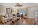 Bright living room featuring comfy seating, a coffee table, and tiled floors at 773 N Jefferson Ave # 773, Sarasota, FL 34237