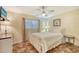 Charming bedroom with a white metal bed frame and ceiling fan at 773 N Jefferson Ave # 773, Sarasota, FL 34237