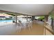 Relaxing pool area with covered seating and tables at 773 N Jefferson Ave # 773, Sarasota, FL 34237