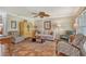Spacious living area with ample seating, a ceiling fan, and tiled floors at 773 N Jefferson Ave # 773, Sarasota, FL 34237