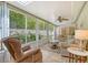 Relaxing sunroom featuring comfortable seating and a ceiling fan at 773 N Jefferson Ave # 773, Sarasota, FL 34237
