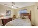 Cozy bedroom featuring a comfortable bed, dresser, and ceiling fan at 773 N Jefferson Ave # 773, Sarasota, FL 34237