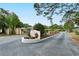 Landscaped entrance to Jefferson Pines, featuring a welcoming sign at 773 N Jefferson Ave # 773, Sarasota, FL 34237